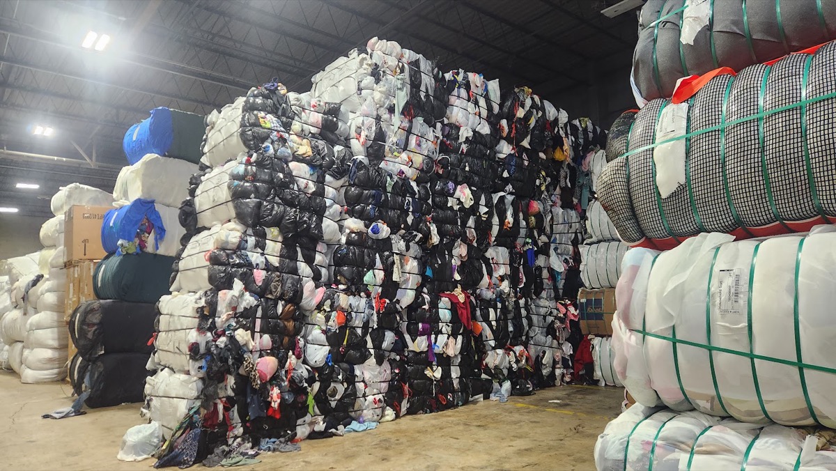 Baled textiles in warehouse